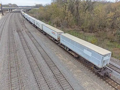 Spine cars with semi trailers on them