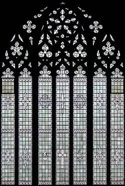 Decorated window (c.1917) at the west end of the nave.
