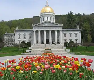 Image 22The gold leaf dome of the Vermont State House in Montpelier is visible for many miles around the city. This is the third State House on the site, and like the second, was built in the Greek Revival architectural style. It was completed in 1857. Montpelier became the state capital in 1805. (from History of Vermont)
