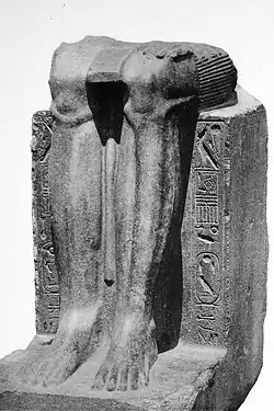 Remains of a statue of the Twelfth Dynasty reappropriated by Hyksos ruler Khyan, with his cartouche inscribed on the sides over an erasure.[1]