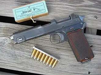 Steyr M1912 pistol with box and stripper clip of 9×23mm Steyr ammunition