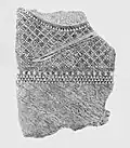 Stele fragment depicting patterned clothing, Switzerland, c. 2500 BC