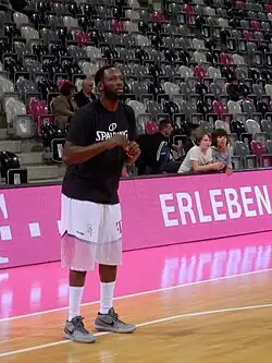Jimmy McKinney is shooting a 3-pointer for a team in Germany