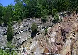 There is a billion-year gap in the geologic record where this 500-million-year-old dolomite nonconformably overlies 1.5-billion-year-old rhyolite, near Taum Sauk Hydroelectric Power Station, Missouri.