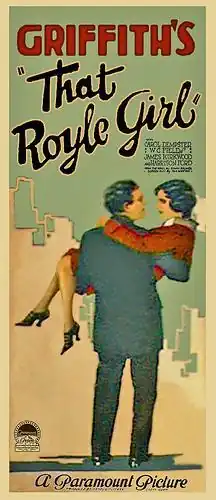 Film poster showing a man carrying a woman in front of a cityscape