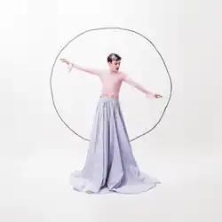 The cover artwork for "The Code". The cover features Nemo in a pink and blue dress. Behind Nemo is a drawing of an imperfect circle.