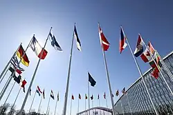 The Finnish flag flying alongside the flags of other NATO members at NATO headquarters.