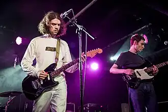 The Night Café members Sean Martin and Arran O'Connell-Whittle performing on stage in Manchester