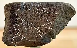 Image 18This basalt stone is incised with a scene showing two animals, probably gazelles. From Dhuweila, eastern Jordan, c. 6200 BCE. British Museum (from History of Jordan)