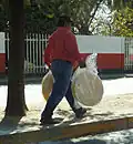 Large toasted tortillas are used for making tlayudas being sold by a street vendor in Oaxaca