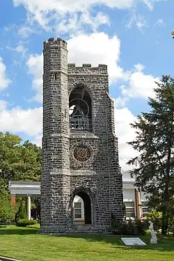 The 1886 Gothic Revival Bell Tower designed by Cope and Stewardson sits at the highest elevation in West Laurel Hill Cemetery