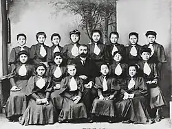 Rows of Pontian girls in school uniforms with their teacher.