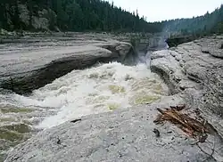 Rapids on Trout River, from Mackenzie Highway 61°8′42″N 119°50′46″W / 61.14500°N 119.84611°W / 61.14500; -119.84611