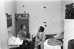 Turks in destroyed houses