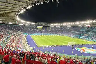 The stadium at night, seen from the stands