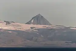 Pogramni (6,569 ft; 2,002 m) volcano as seen from the Unimak Pass in the morning light.