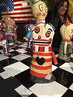 Kirsten standing behind one of her ceramic robots, October 8th, 2015