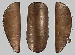 Bronze greave with sun cross symbols, Hungary
