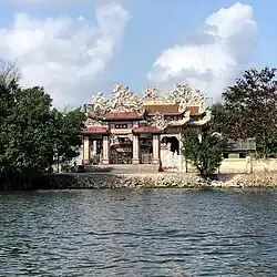 Tam quan of a temple next to the river