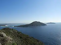 Photo of several island clusters in a coastal region.