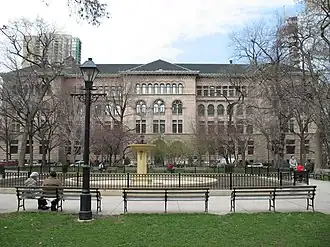 Washington Square Park is pictured with Newberry Library in the background.