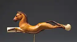 The horse was probably introduced to Egypt by the Hyksos, and became a favourite subject of Egyptian art, as in this whip handle from the reign of Amenhotep III (1390–1353 BC).[181]