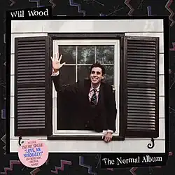 Will Wood reaches out and waves from an open window; the picture is surrounded by a black frame with colorful zig-zags scattered around and the album's name and author written in a serif font that has been wriggled around