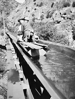 Making repairs aboard a flume boat.