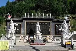 A stone wall at Baiyun Temple.