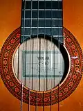 close-up view of rosette on modern classical guitar.