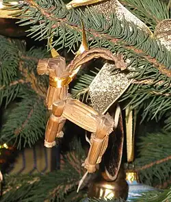 A yule goat on a Christmas tree in Scandinavia